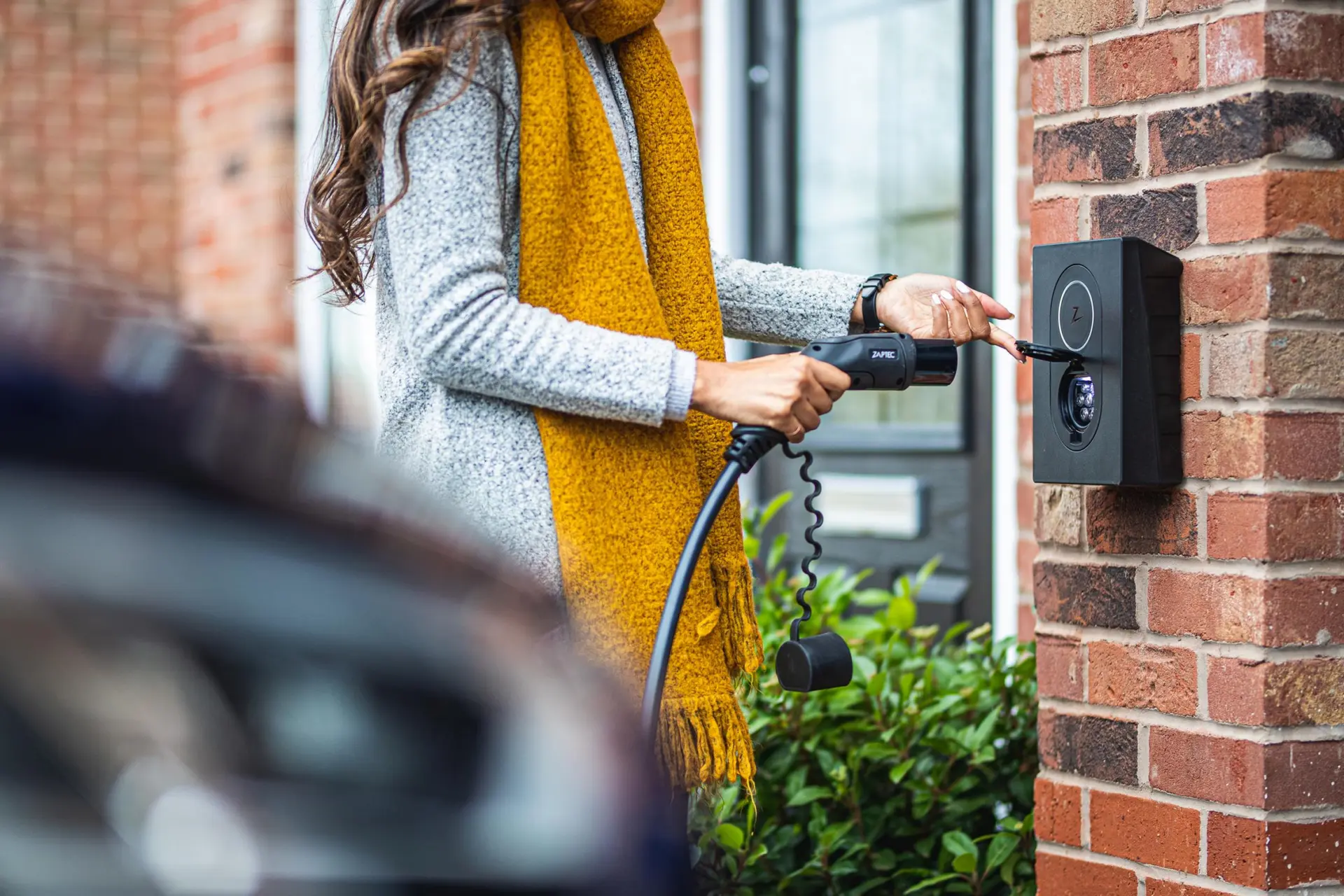 a girl is pluging in a plug
